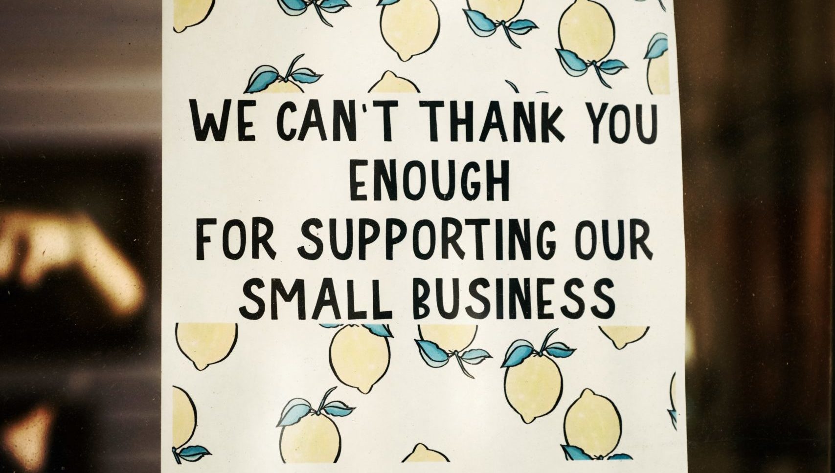 A sign that says thanks for supporting our small business.
